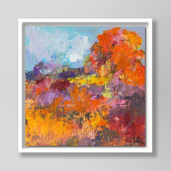 Landscape with wildflowers and a big red-orange tree