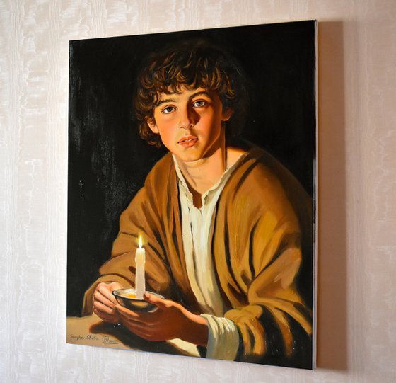 A boy with a candle