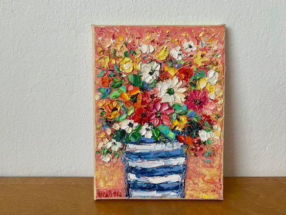 Flowers bouquet in striped vase