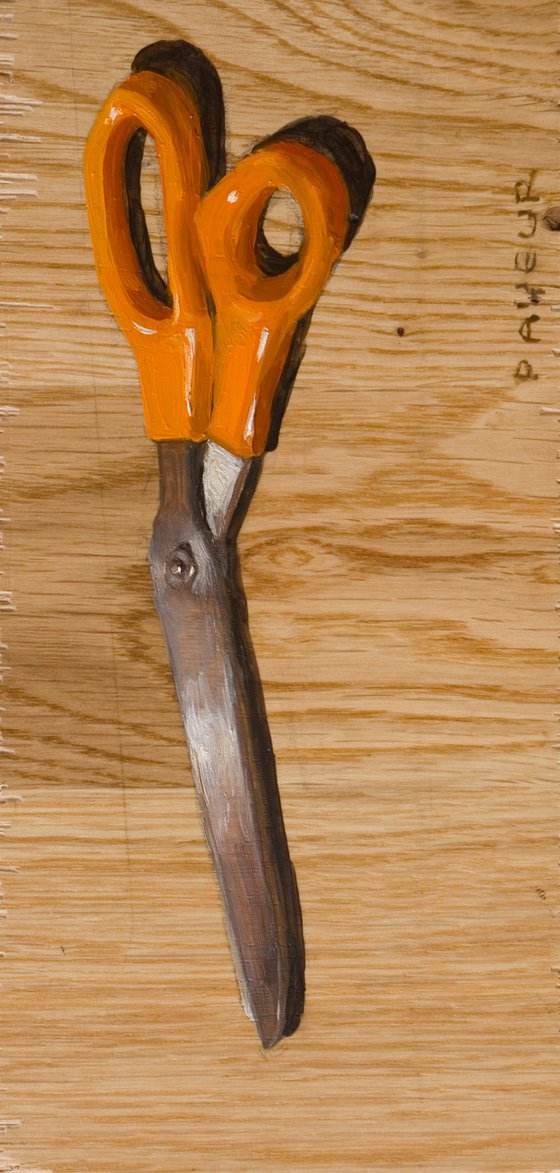 scissors on parquet plank