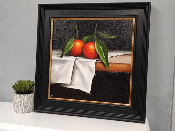 Clementines on cloth still life