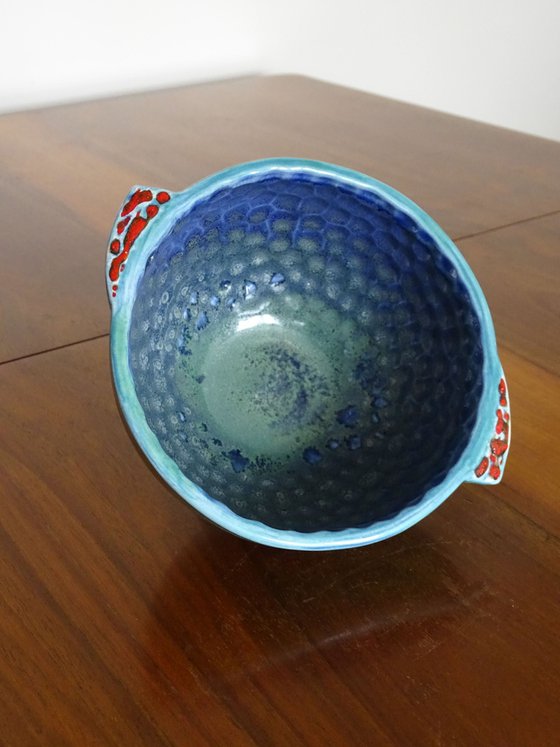 "Bowl with hammer pattern inside"