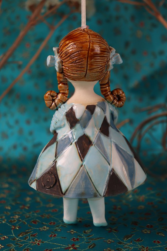 Little Girl in Blue Harlequine Dress. Tiny hanging sculpture