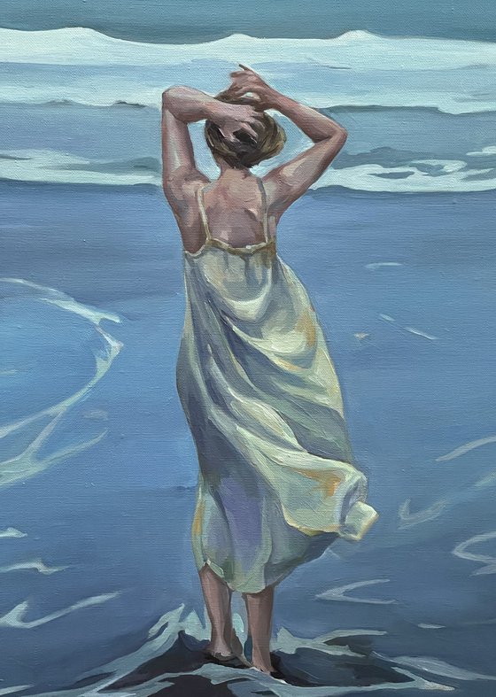 Pacific Ocean.Girl in sundress