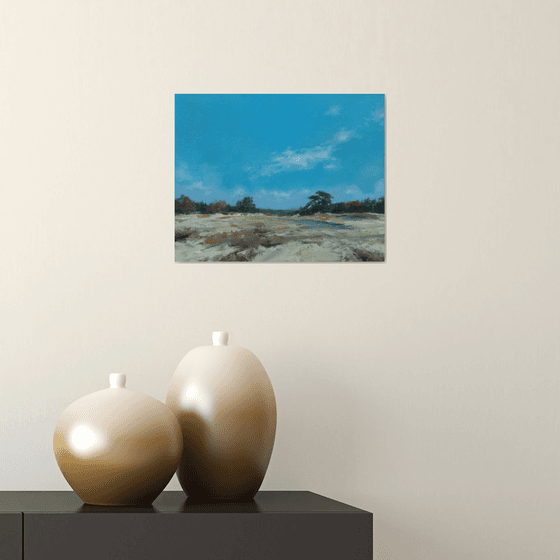 Dunes under a blue sky.