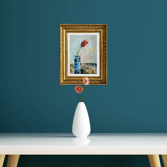 A Single Tulip in a Blue Vase