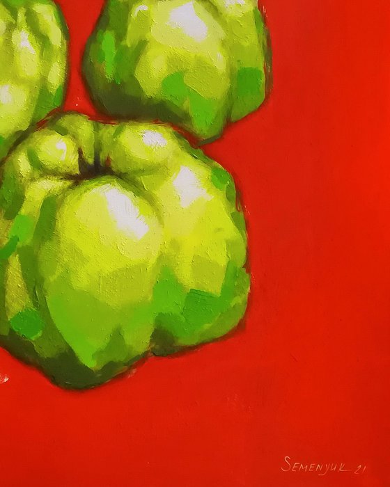 Green fruits on red background