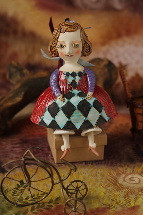 Little girl in red dress. Hanging sculpture, bell doll by Elya Yalonetski