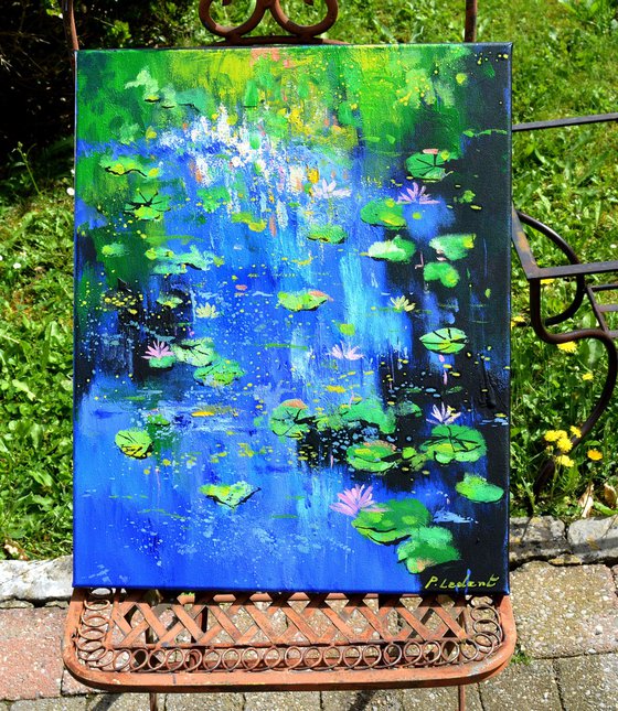 Waterlilies on a blue pond