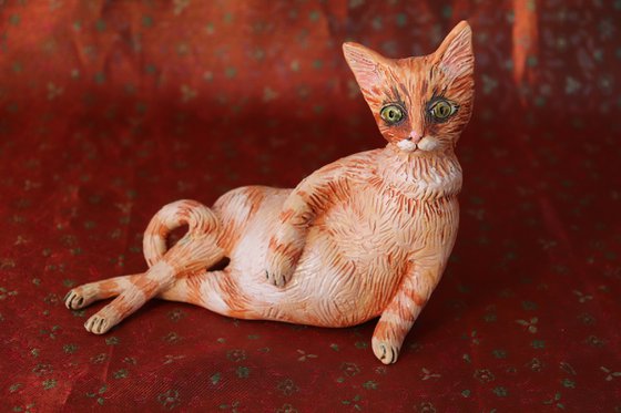 Red Fury Resting. Ceramic cat sculpture.