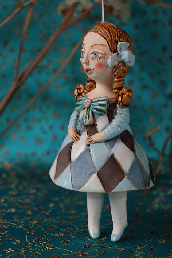 Little Girl in Blue Harlequine Dress. Tiny hanging sculpture