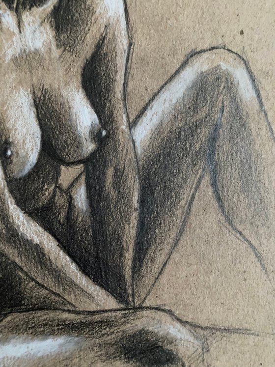 Nude sitting woman