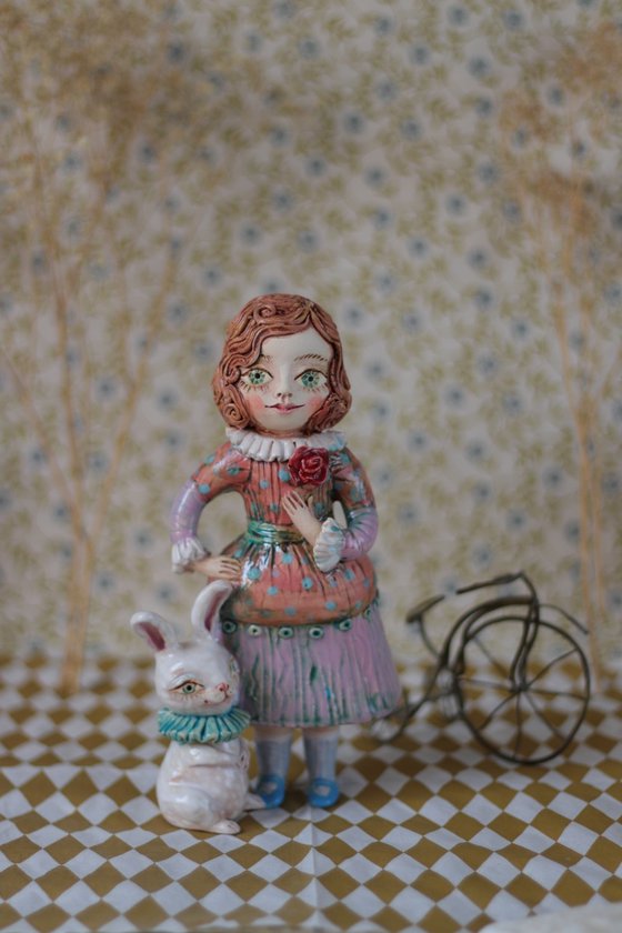 Vintage dressed girl with a rabbit