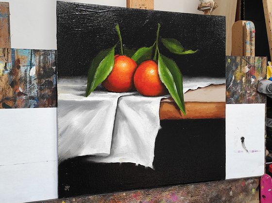 Clementines on cloth still life