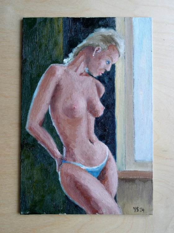 Female Figure Standing Near The Window