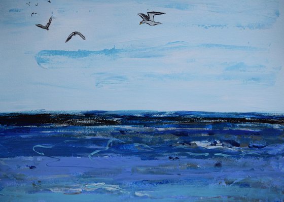 Big blue ocean with birds