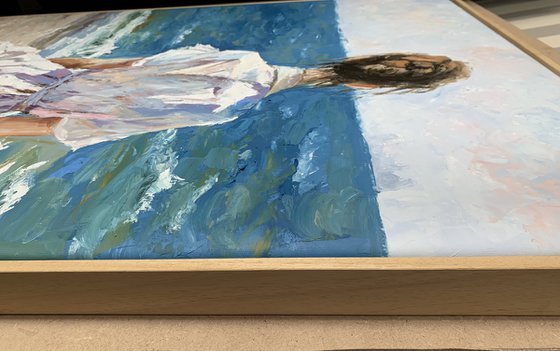 Woman by the ocean.