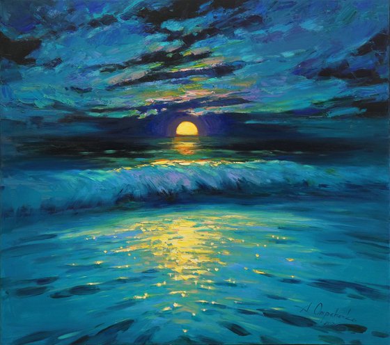 Moonrise in blue over sea