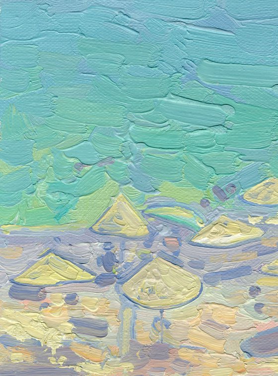 Yachts and umbrellas on the beach