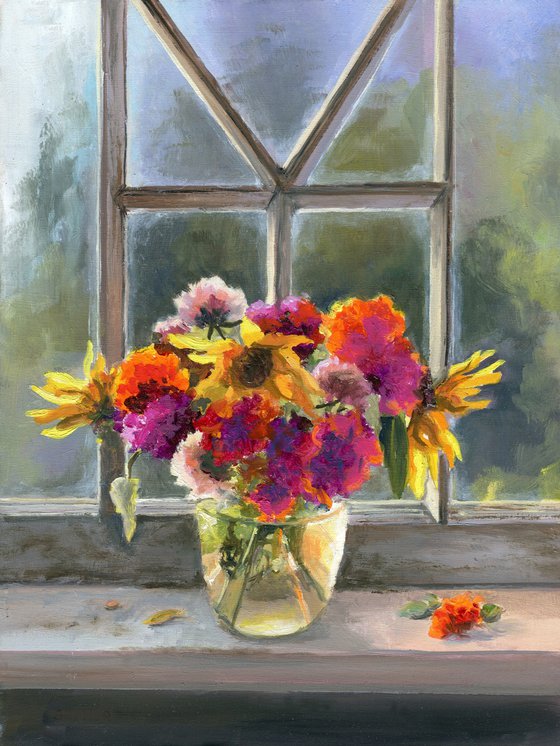 Vase of marigolds on a window