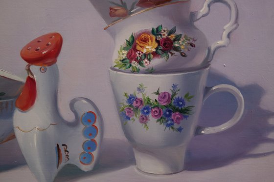 "Still life with a figurine of a rooster"