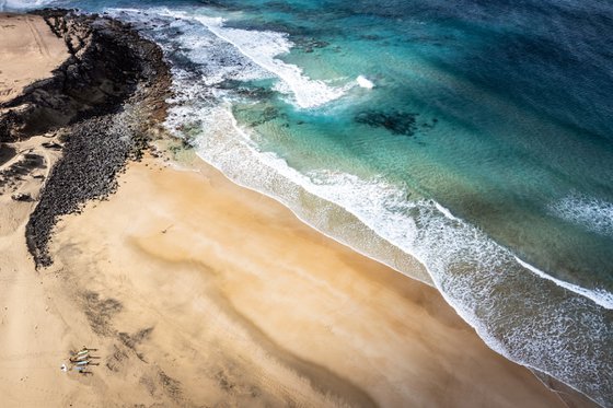 SURFERS ON THE BEACH
