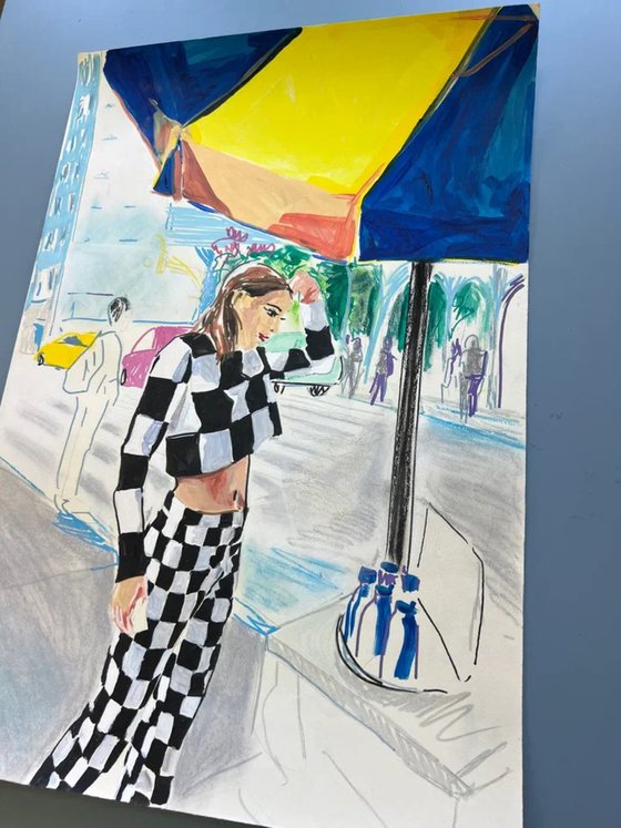 Woman Under Blue and Yellow Umbrella