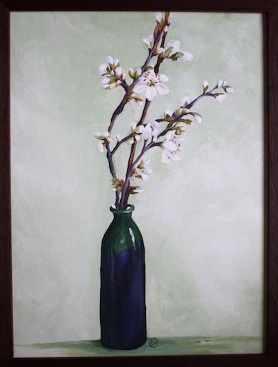 Blossom in a green vase