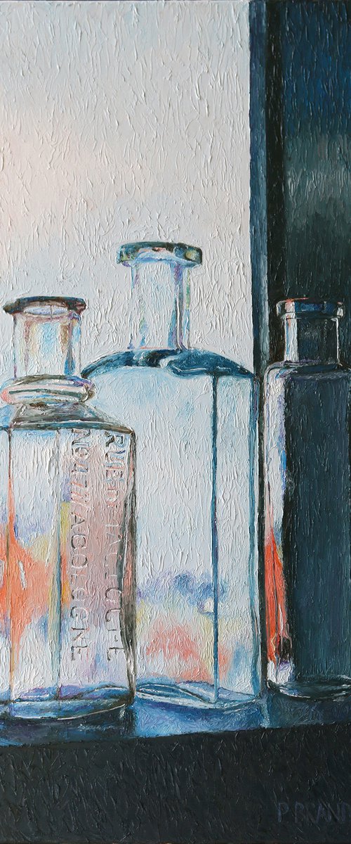 Vintage bottles in window by Paul Brandner