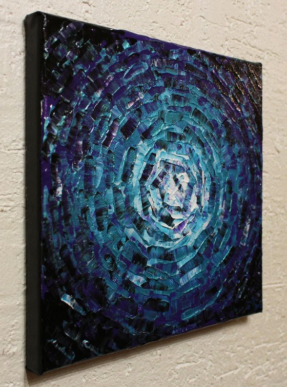 Small shine of iridescent purple blue glow