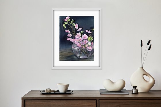 Still life with cherry blossoms in a vase.