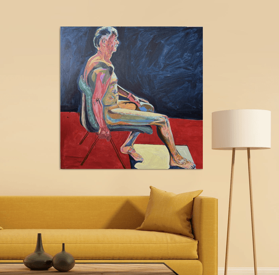 Seated Chap in dark blue room