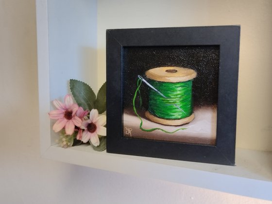 Little  green cotton reel  still life