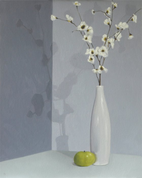 White vase, flowers and apple