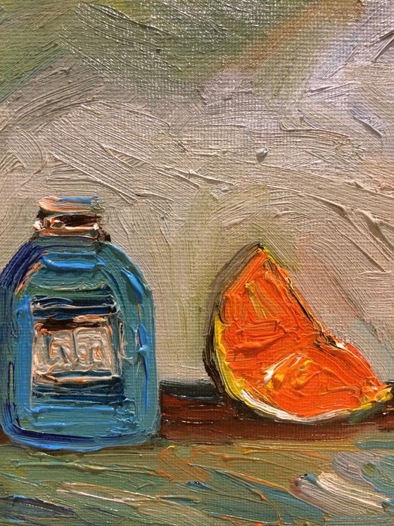 Orange slice and Blue Bottle