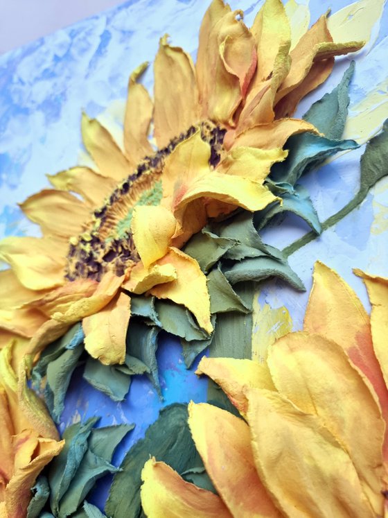 Sunflowers. Fragments of the summer sun. / floral still life relief with bright yellow flowers on a blue background