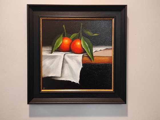 Clementines on cloth still life