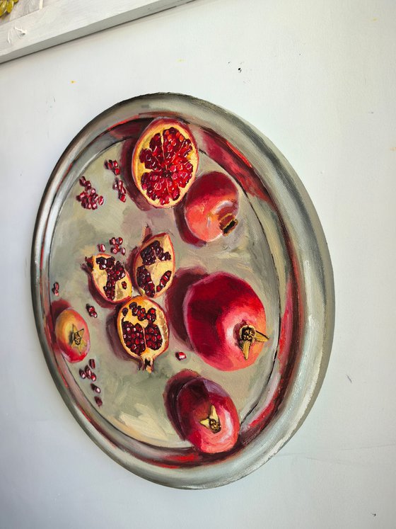 Pomegranates on metal try