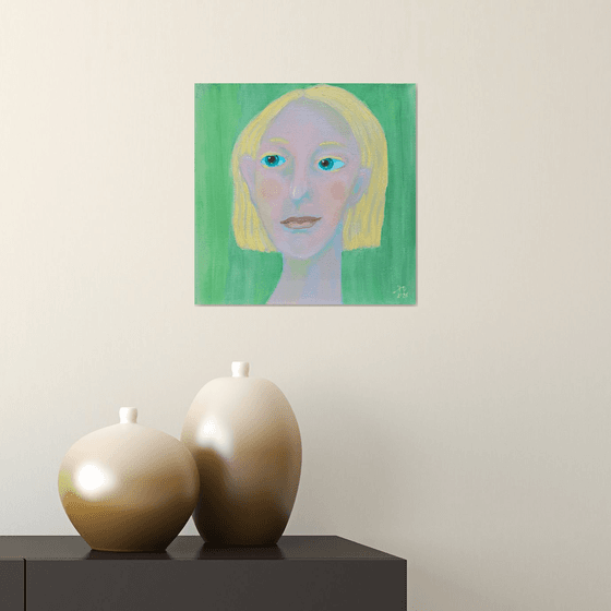 Young and blond soft green woman portrait