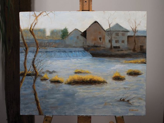 Weir and old industry on the river Vienne on a winter's day