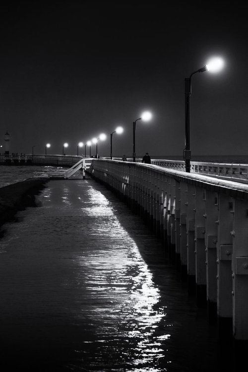 Lonesome walk along the winter pier by Christian  Schwarz