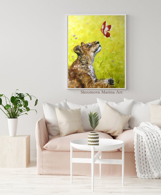 SMALL CHARM -Little lion cub. Adorable lion cub and butterfly. Simba plays. Cute predator. The lion king. Fairy tale. Wild nature. Flower meadow.