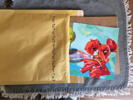 Red poppies in vase and pear