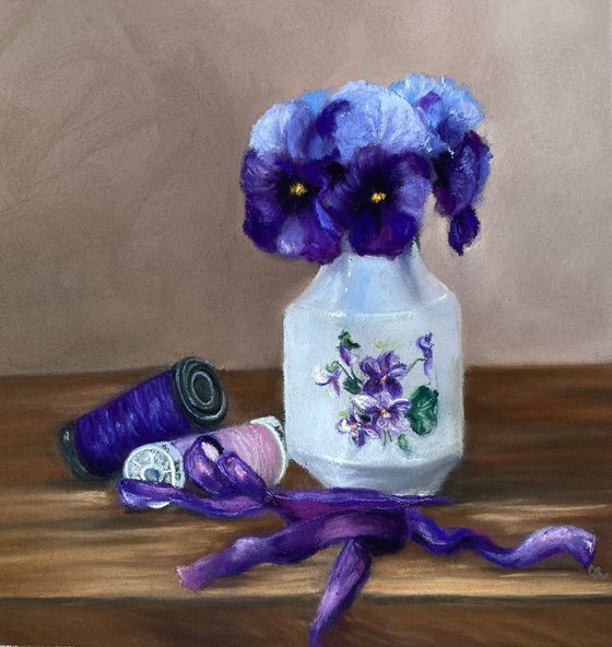 Violets, ribbon and cotton reels