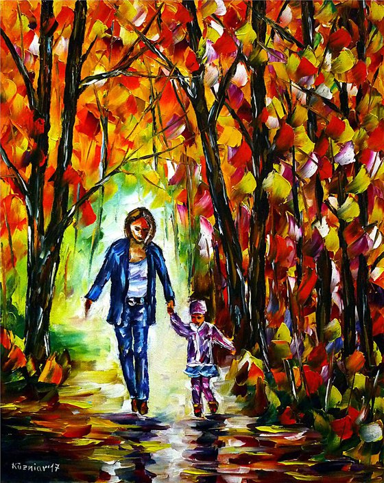 Mother with daughter in autumn forest