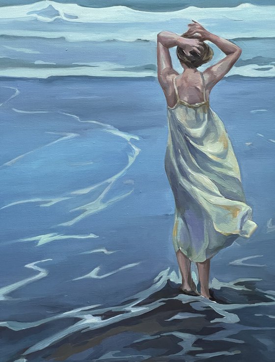 Pacific Ocean.Girl in sundress