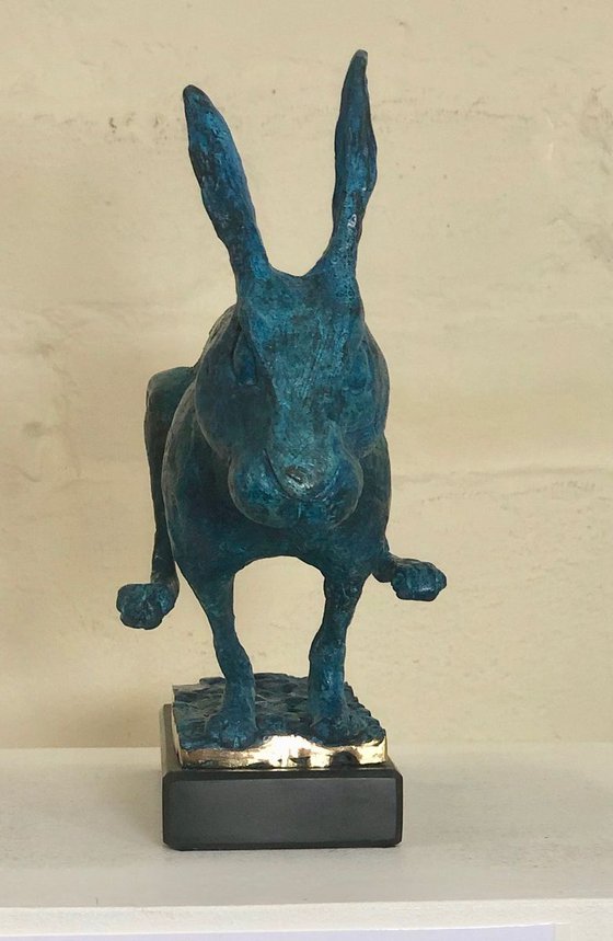 running hare in vivid blue