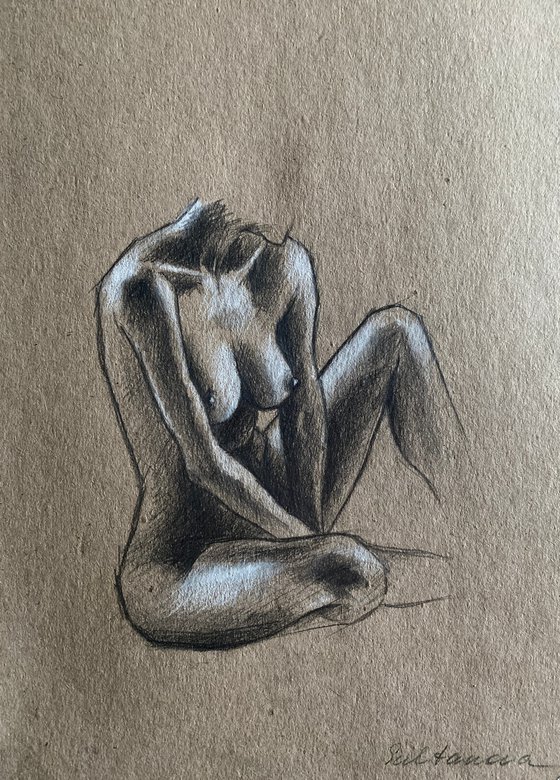 Nude sitting woman