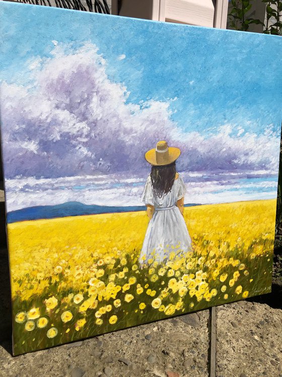 Summer. Woman in flower field