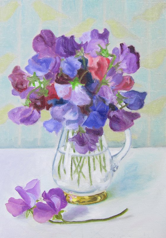 Sweet peas in glass jug